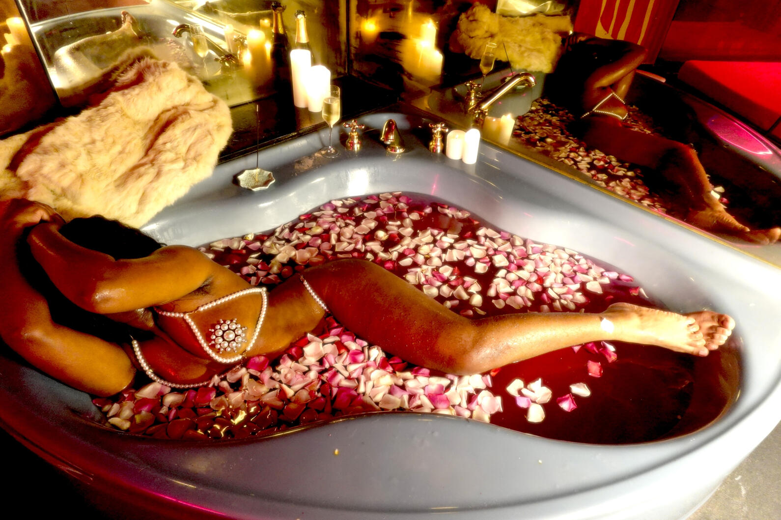 Black woman bathes in a tub